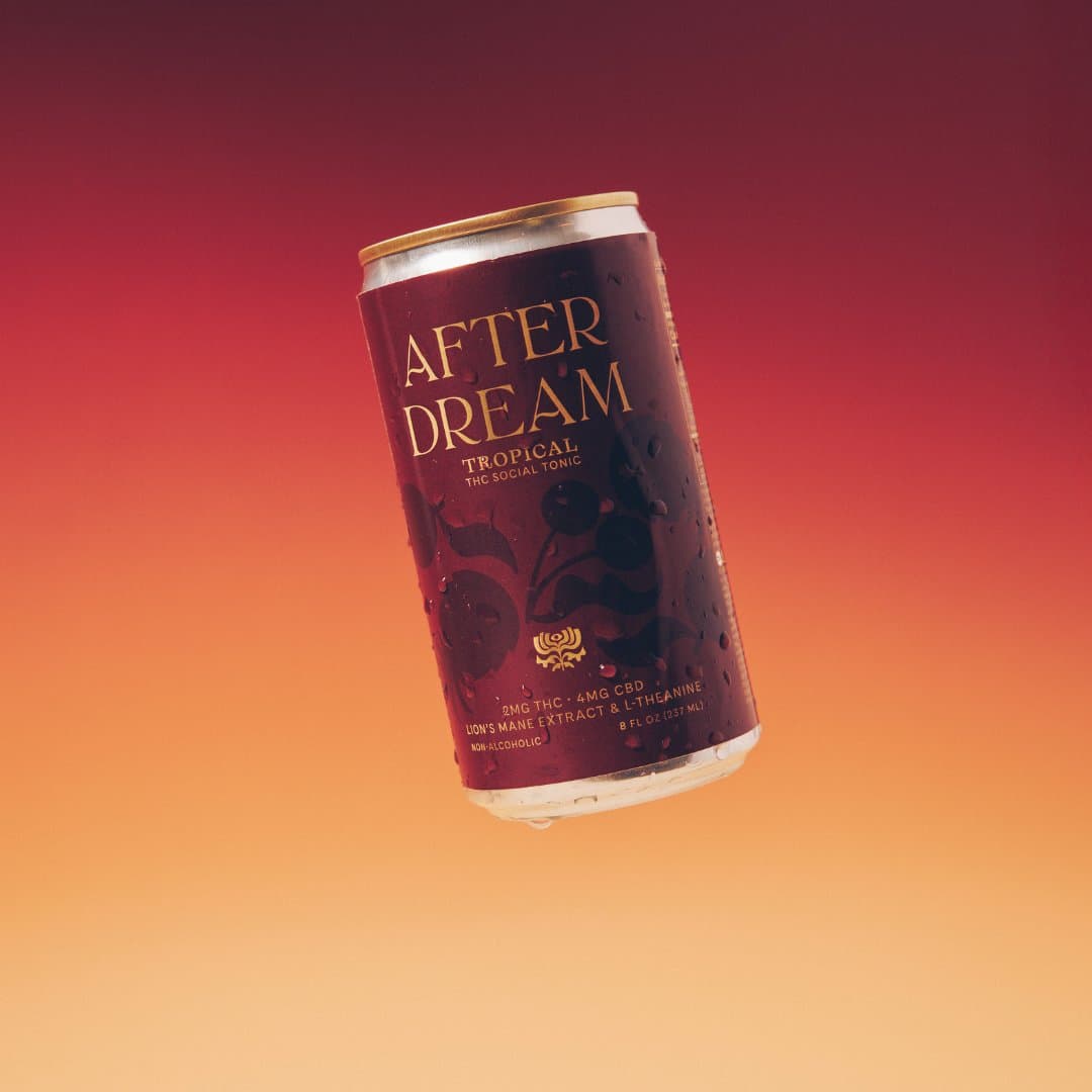 A can of Afterdream Tropical THC social tonic against a red gradient background