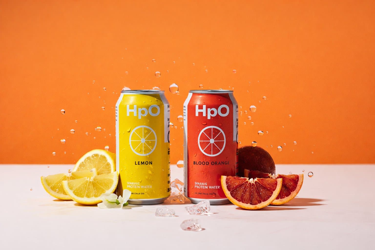 Cans of HpO sparkling protein water in lemon and blood orange flavors